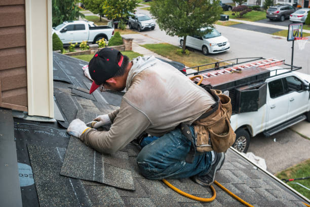 Professional Roof Replacement technician working in Crockett, TX